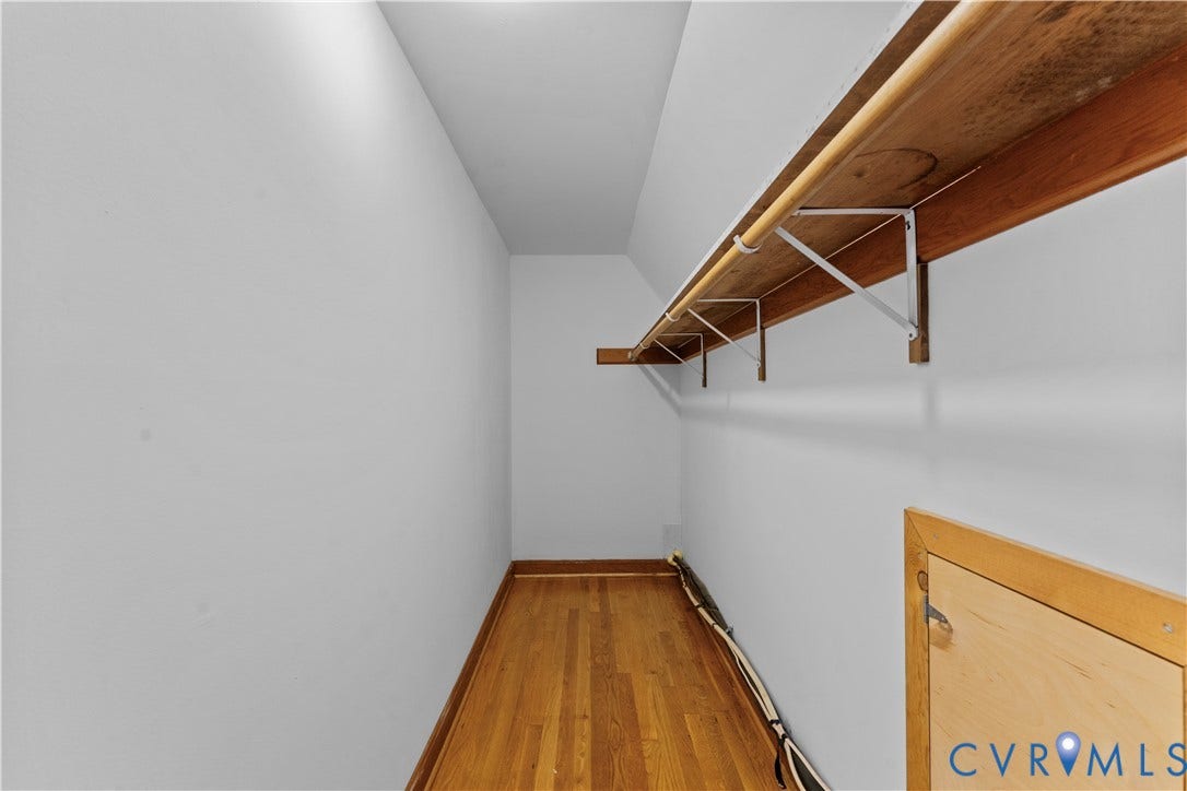 11612 Yorkdale Drive, Rivers Edge, North Prince George, VA 23860 Hardwood flooring and a built-in shelving system with a hanging rod
