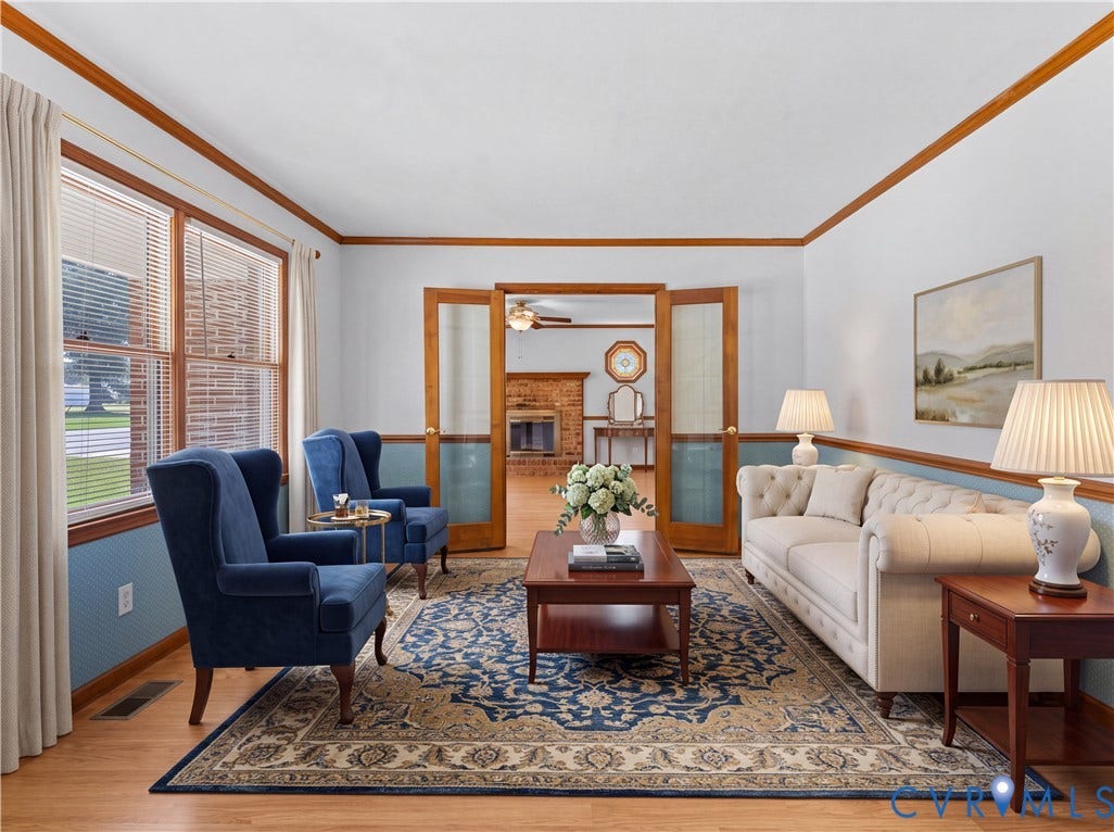 11612 Yorkdale Drive, Rivers Edge, North Prince George, VA 23860 Wood-finish flooring with complementary wood trim, double French doors, large windows, and a two-tone wall finish