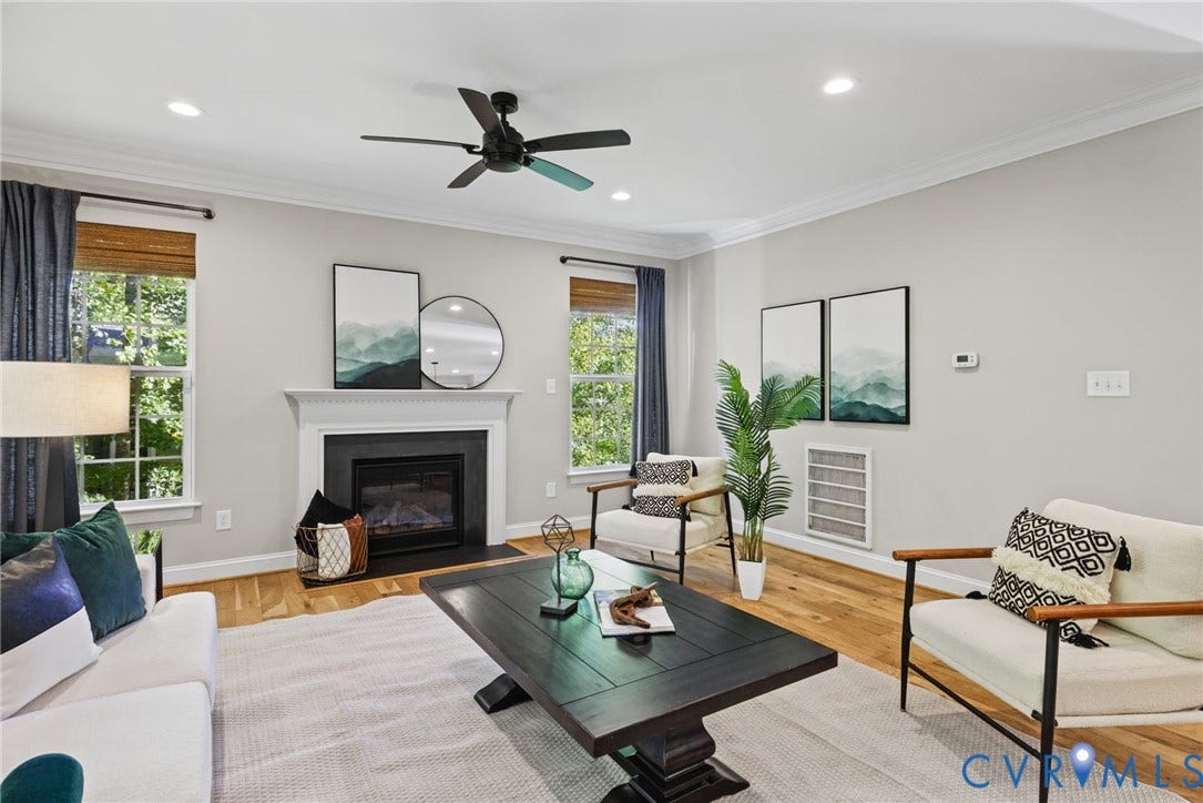 1425 Montcroft Way, Midlothian, VA 23112 Living area featuring wood-finish flooring, a fireplace with a black surround and mantle, recessed lighting, crown molding, and a central ceiling fan
