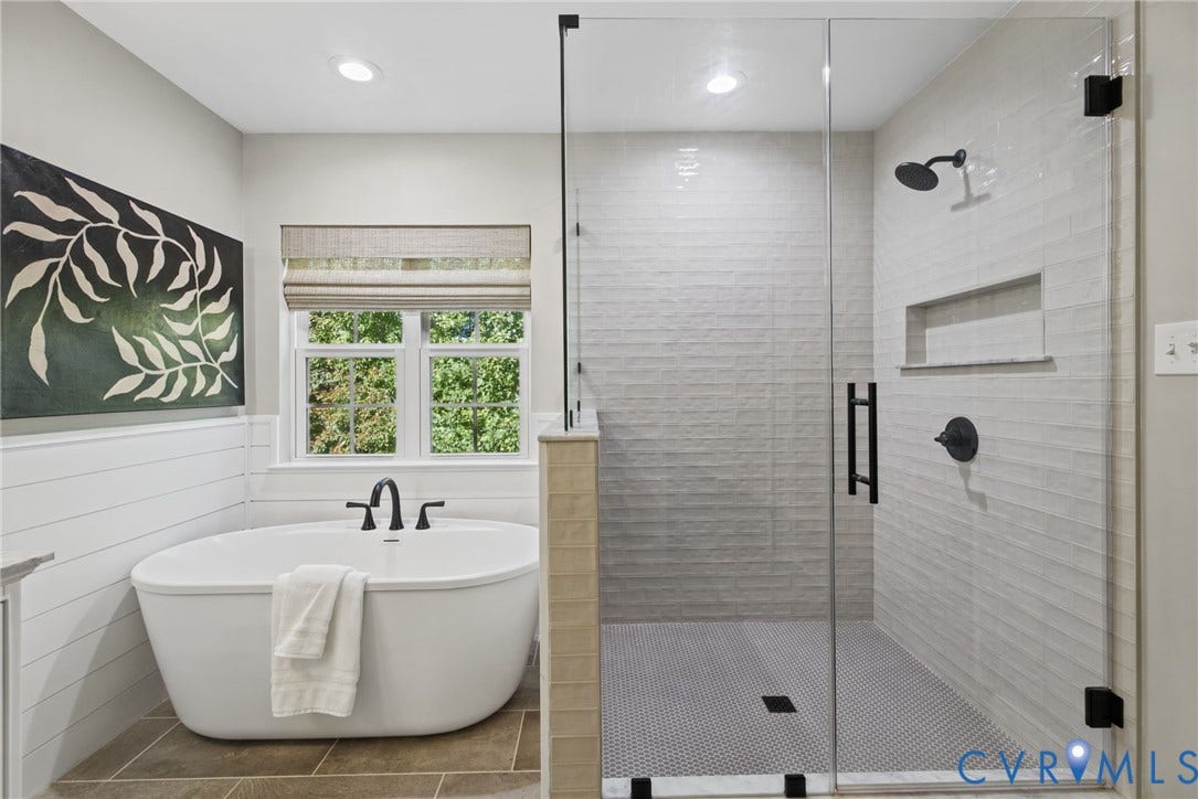 1425 Montcroft Way, Midlothian, VA 23112 Freestanding soaking tub with matte black faucet, walk-in glass-enclosed shower featuring a recessed wall niche, horizontal shiplap wall paneling, and ceramic tile flooring