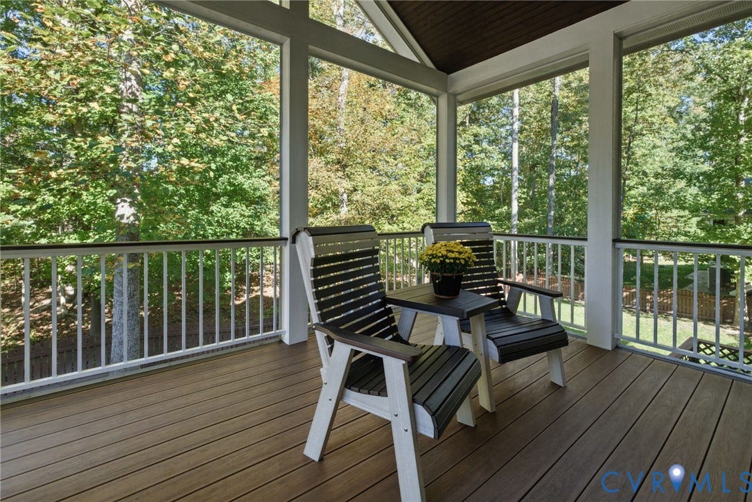 1425 Montcroft Way, Midlothian, VA 23112 Screened-in porch featuring wood-finish decking, a vaulted ceiling, and white vertical baluster railings