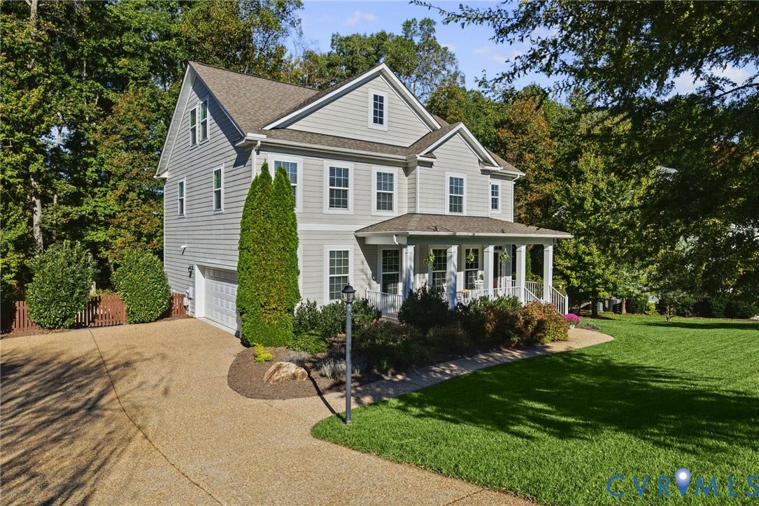 1425 Montcroft Way, Midlothian, VA 23112 Two-story home with light-toned horizontal siding, gable roof lines, a covered front porch with columns, and an attached side-entry garage