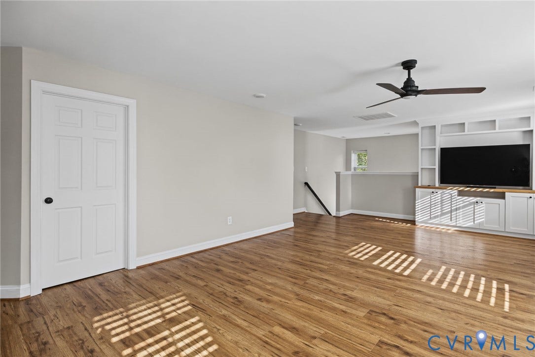 1425 Montcroft Way, Midlothian, VA 23112 Interior space featuring wood-finish flooring, white built-in cabinetry, and a ceiling fan with matte black finish