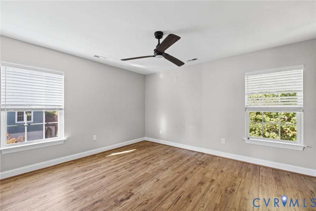 1425 Montcroft Way, Midlothian, VA 23112 Room featuring wood-finish flooring, a matte black three-blade ceiling fan, and windows with integrated blinds