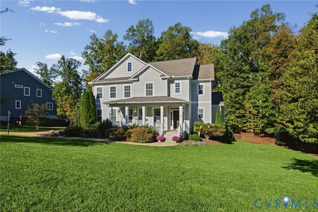 1425 Montcroft Way, Midlothian, VA 23112 Two-story home with light-toned horizontal siding, a covered front porch featuring square columns, a gabled roofline, and extensive landscaped grounds