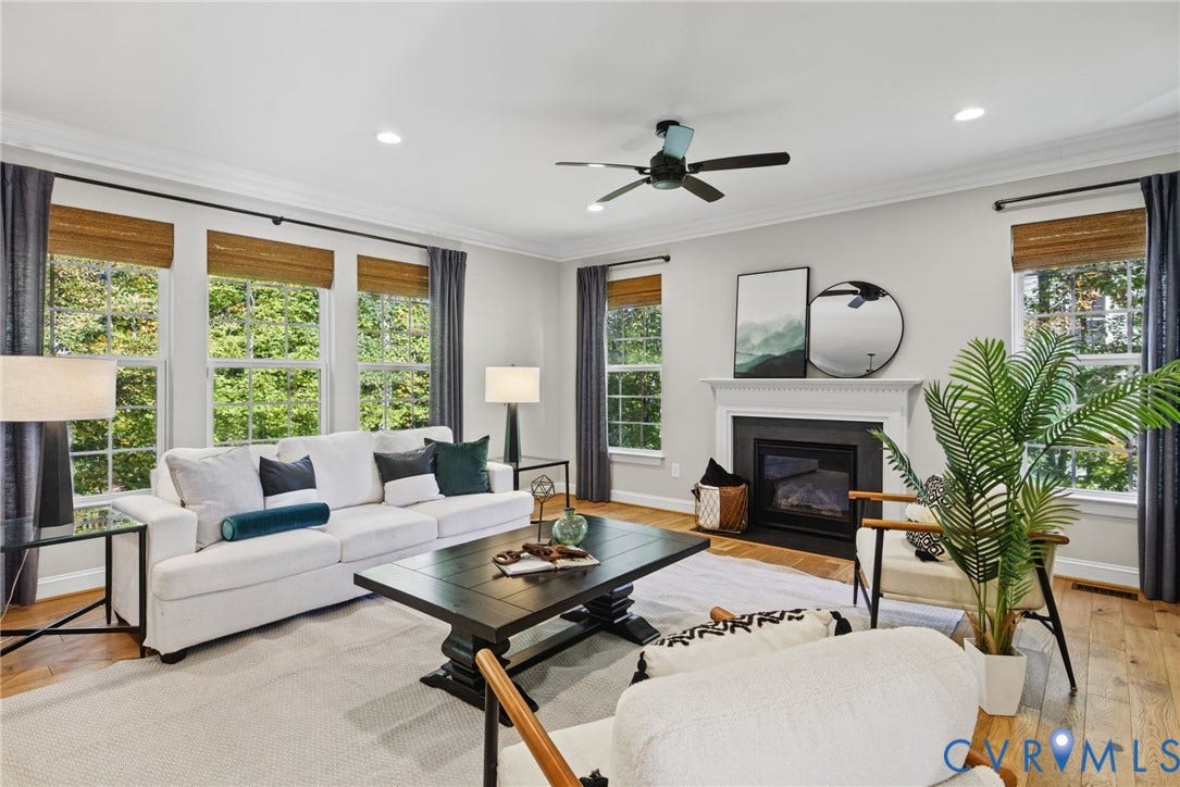 1425 Montcroft Way, Midlothian, VA 23112 Living area featuring wood-finish flooring, crown molding, recessed lighting, a ceiling fan, and a fireplace with a decorative mantel