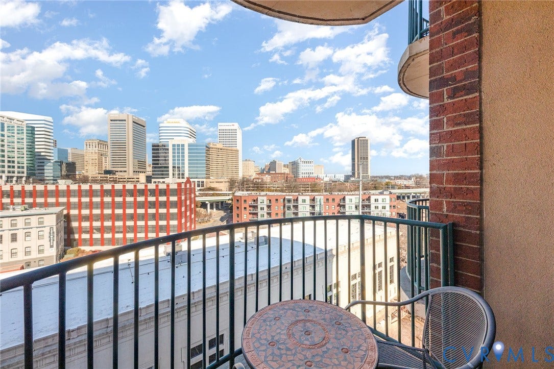 1101 Haxall Point, #709, Richmond, VA 23219 Balcony with metal railings and a brick exterior column