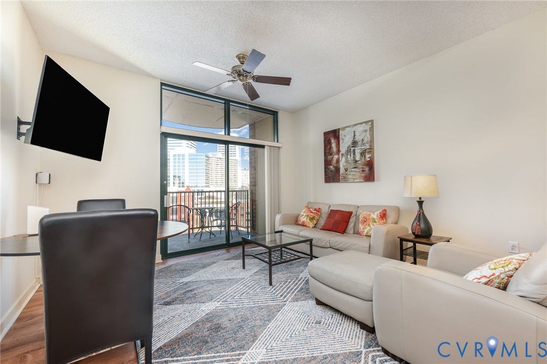 1101 Haxall Point, #709, Richmond, VA 23219 Sliding glass door leading to a balcony, ceiling fan, and recessed lighting