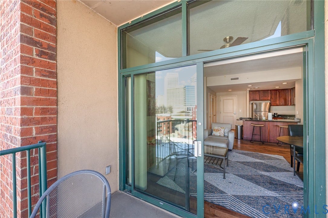 1101 Haxall Point, #709, Richmond, VA 23219 Private balcony with brick detailing and stucco walls