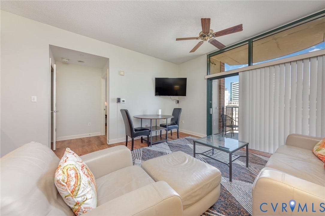 1101 Haxall Point, #709, Richmond, VA 23219 Wood-finish flooring throughout, paired with a ceiling fan