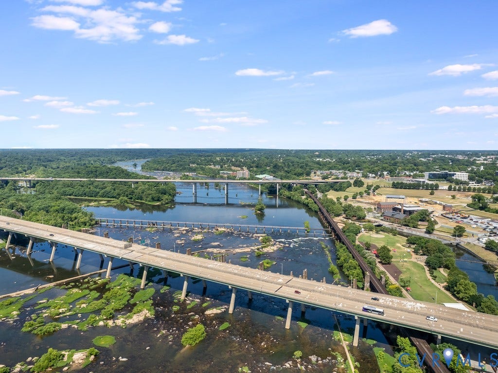 1101 Haxall Point, #511, Richmond, VA 23219 Expansive river setting with multiple bridges, surrounding green spaces, and distant urban development