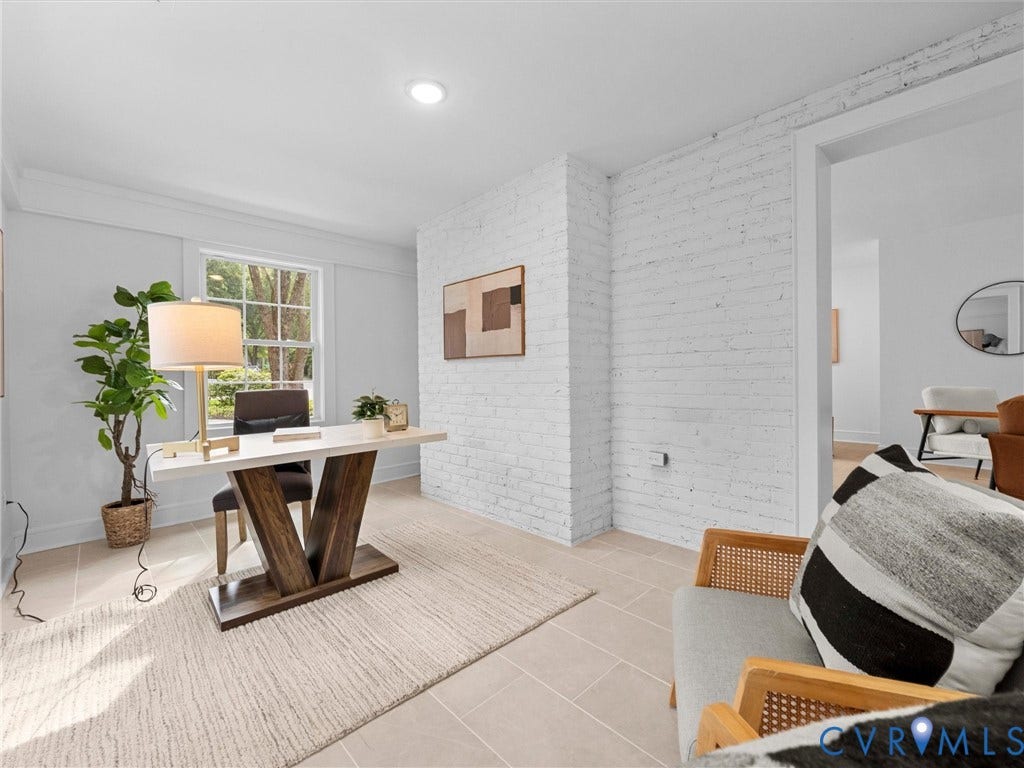 702 Westham Parkway, Westham, Henrico, VA 23229 White brick accent wall with a large window and recessed lighting