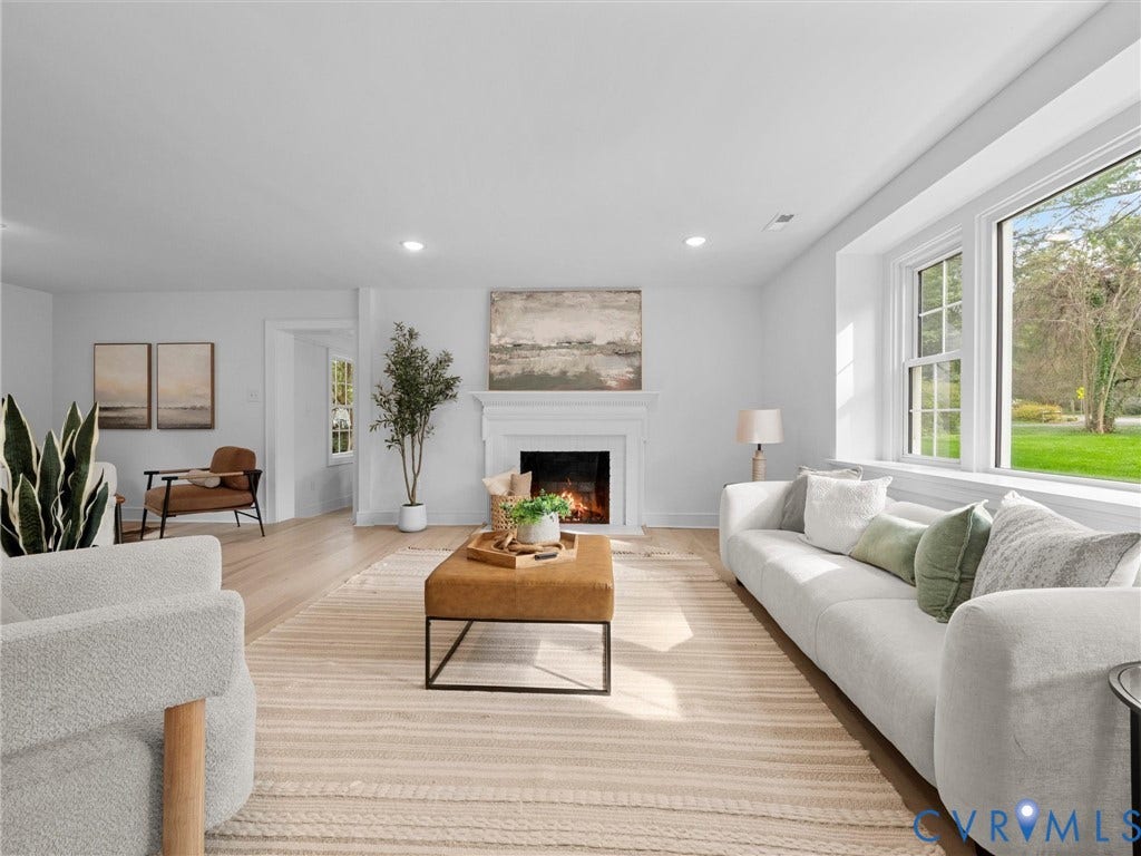 702 Westham Parkway, Westham, Henrico, VA 23229 Recessed lighting, wood-finish flooring, a fireplace with a white mantel, and large windows with outdoor scenery