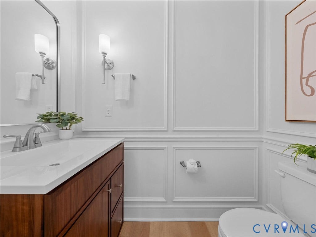 702 Westham Parkway, Westham, Henrico, VA 23229 Wood-finish vanity with integrated sink and brushed nickel faucet
