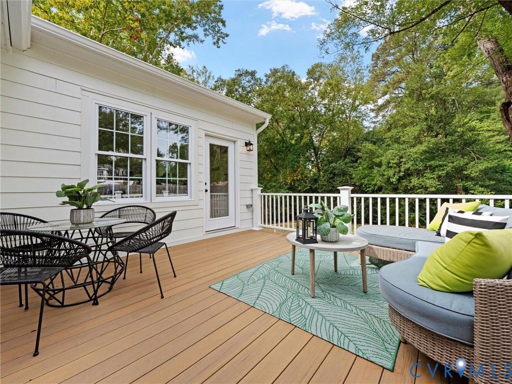 702 Westham Parkway, Westham, Henrico, VA 23229 Expansive composite deck with white railing, featuring white siding, multiple double-hung windows, and a glass-paneled door