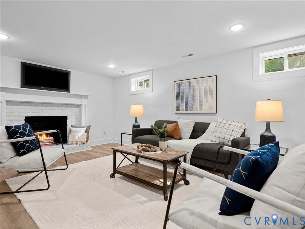702 Westham Parkway, Westham, Henrico, VA 23229 White painted brick fireplace with mantel, recessed ceiling lighting, wood-finish flooring, and white window trim