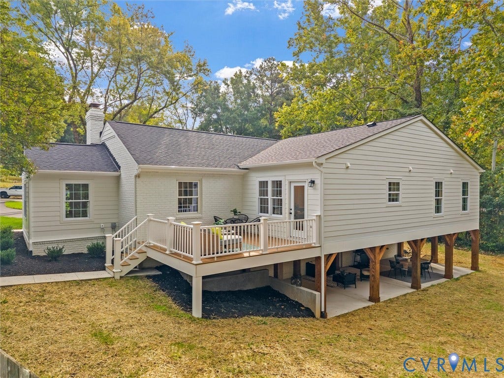 702 Westham Parkway, Westham, Henrico, VA 23229 Rear exterior featuring a multi-level wood deck with white railings, a covered patio area with exposed wood beams, and white brick and siding finishes