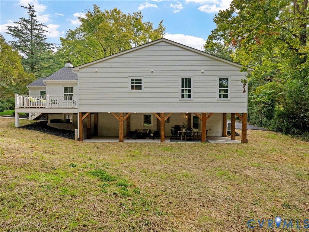 702 Westham Parkway, Westham, Henrico, VA 23229 White horizontal siding exterior with a gabled roofline and an elevated deck featuring white railings