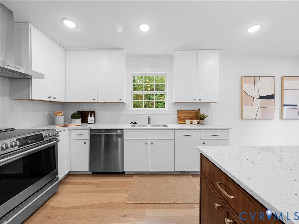 702 Westham Parkway, Westham, Henrico, VA 23229 Modern kitchen featuring white cabinetry, light wood-finish flooring, stainless steel appliances, recessed ceiling lighting, and light-colored countertops