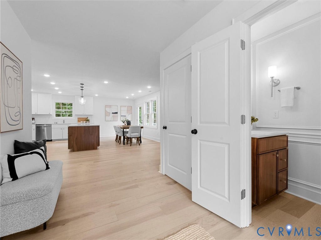 702 Westham Parkway, Westham, Henrico, VA 23229 Hardwood-finish flooring throughout, recessed ceiling lighting, kitchen island with wood-finish base, stainless steel appliances, and a half-bath with a wood-finish vanity