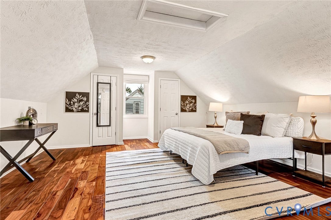 2817 Groveland Avenue, Green Park, Richmond, VA 23222 Sloped ceilings with a ceiling access panel, wood-finish flooring, and white paneled doors