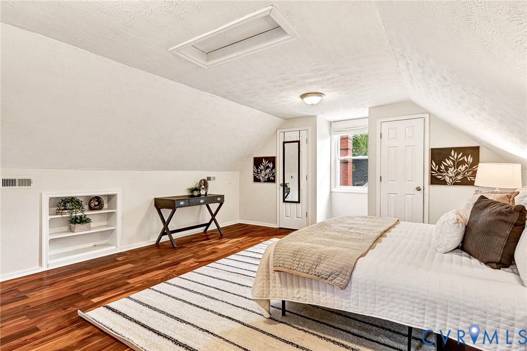 2817 Groveland Avenue, Green Park, Richmond, VA 23222 Sloped ceilings, skylight, wood-finish flooring, built-in shelving, and a bright window