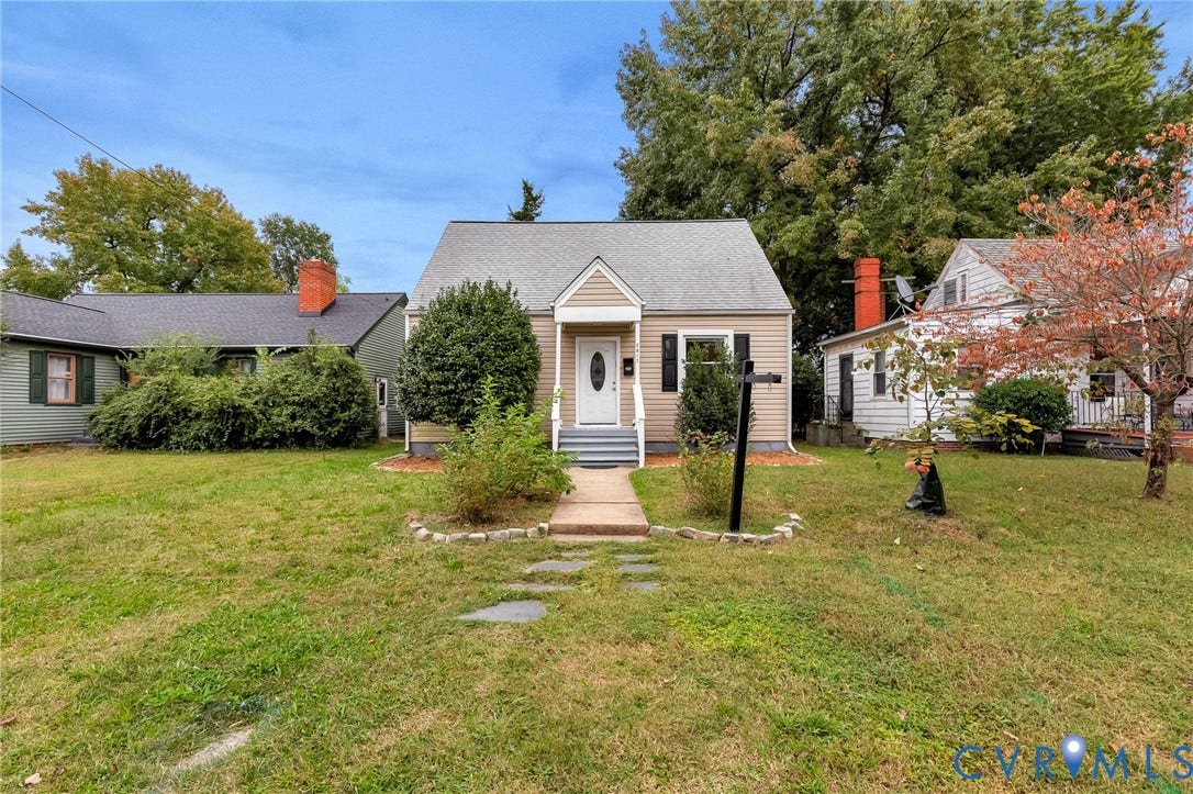 2817 Groveland Avenue, Green Park, Richmond, VA 23222 Siding exterior with front porch, partial stone pathway, and mature trees