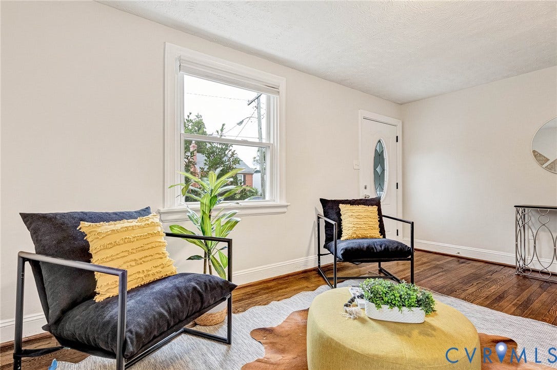 2817 Groveland Avenue, Green Park, Richmond, VA 23222 Warm wood flooring, white trim, and a window with natural light