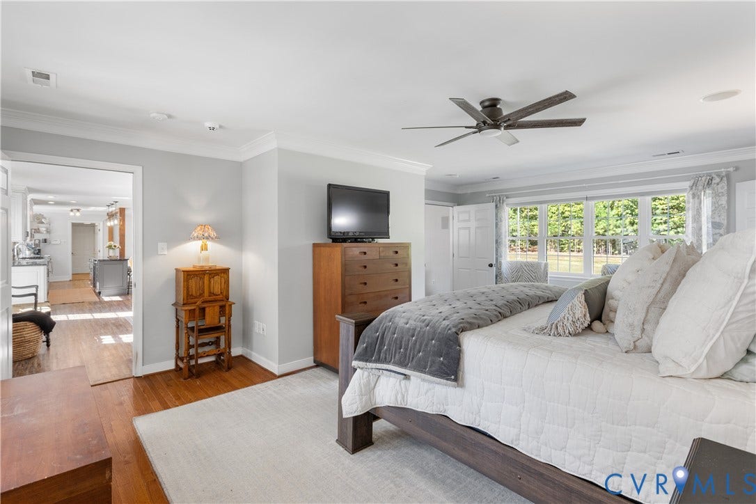 12380 Bienvenue Road, Bowles Acres, Rockville, VA 23146 1st Floor Bedroom featuring wood-finish flooring, crown molding, ceiling fan, Adjoining luxury bath