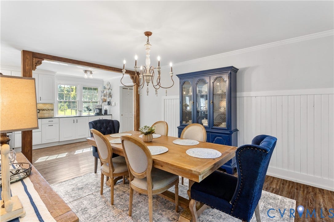 12380 Bienvenue Road, Bowles Acres, Rockville, VA 23146 exposed wooden support beam with decorative corbels, and a multi-arm candle-style chandelier.