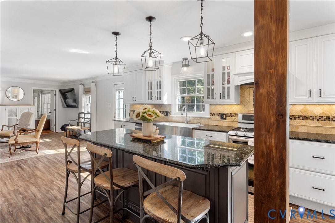 12380 Bienvenue Road, Bowles Acres, Rockville, VA 23146 Kitchen featuring a central island. Structural beam. Lots of bright natural light with full views of the barn and rear concreat paito & courtyard.