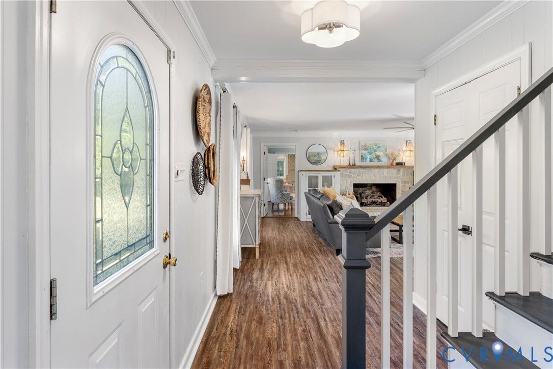 12380 Bienvenue Road, Bowles Acres, Rockville, VA 23146 Entryway featuring an arched glass-panel insulated front door crown molding, coat closet