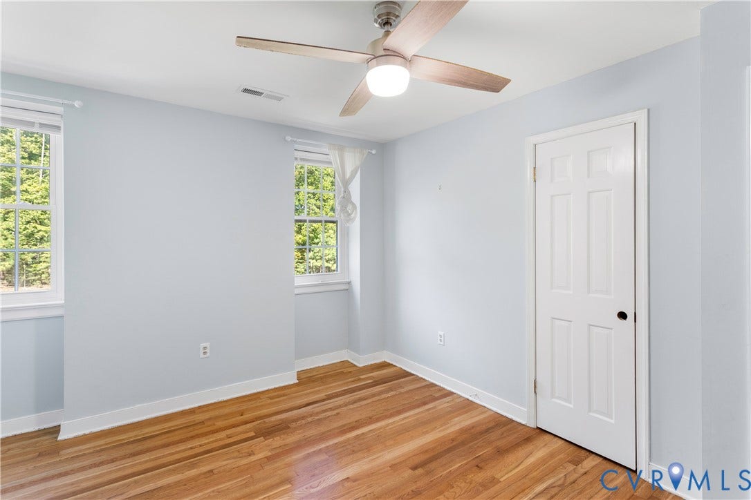 12380 Bienvenue Road, Bowles Acres, Rockville, VA 23146 Room featuring wood-finish flooring, multi-pane windows, and a ceiling fan with integrated lighting