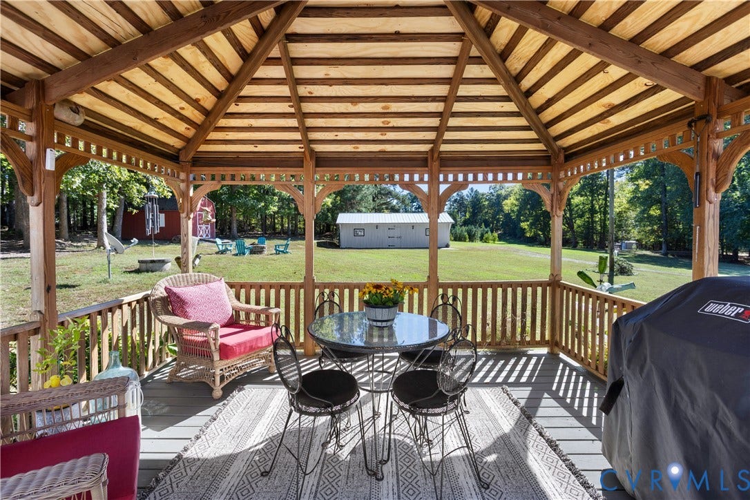 12380 Bienvenue Road, Bowles Acres, Rockville, VA 23146 Covered wooden gazebo featuring a vaulted shiplap ceiling, open-post architecture, and integrated perimeter railing
