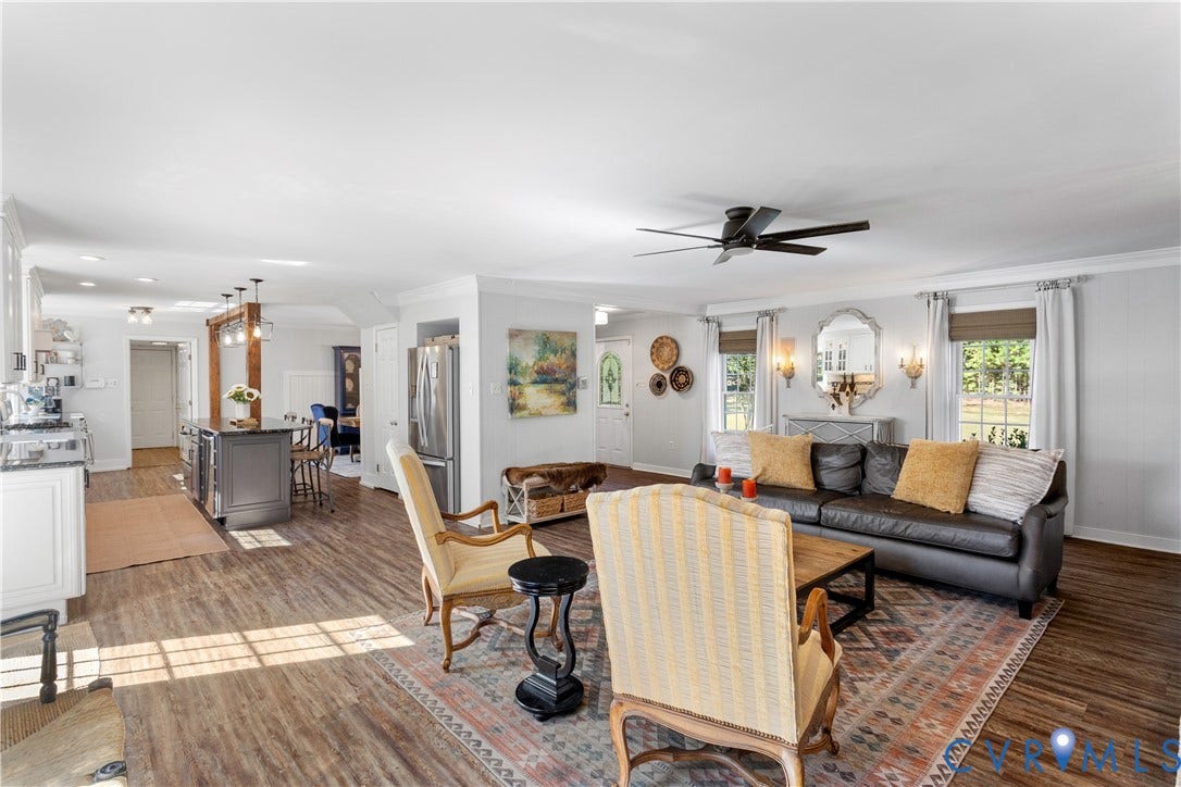 12380 Bienvenue Road, Bowles Acres, Rockville, VA 23146 Open-concept interior featuring LVT flooring, a central island with built-in cabinetry, recessed lighting, and a ceiling fan
