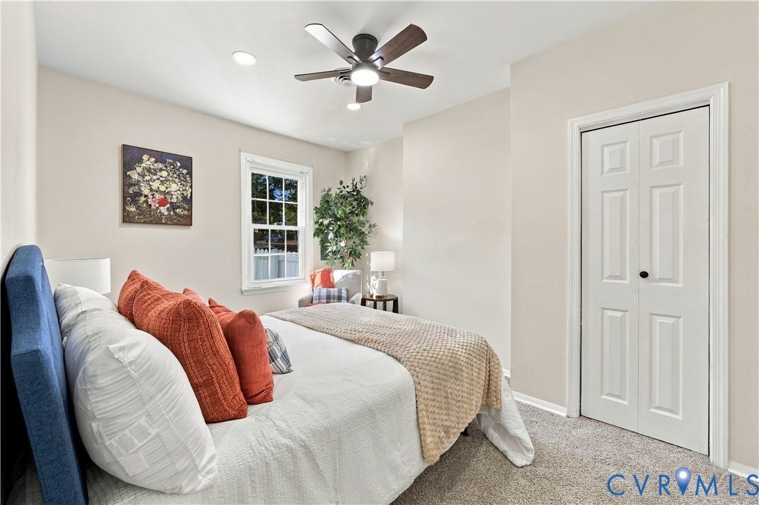 Neutral-toned interior featuring carpeting, a double-panel closet door, recessed lighting, and a multi-blade ceiling fan