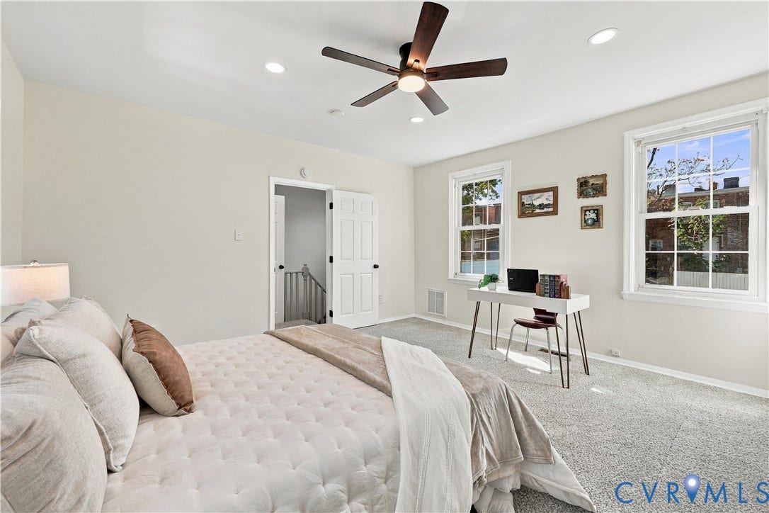 Neutral-toned bedroom featuring recessed lighting, a multi-blade ceiling fan, wall-to-wall carpeting, and double-hung windows