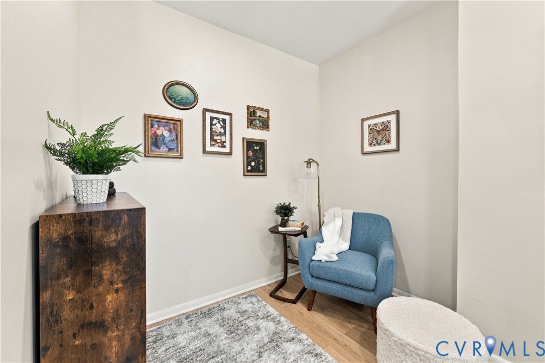 Neutral-toned interior space featuring light wood-finish flooring