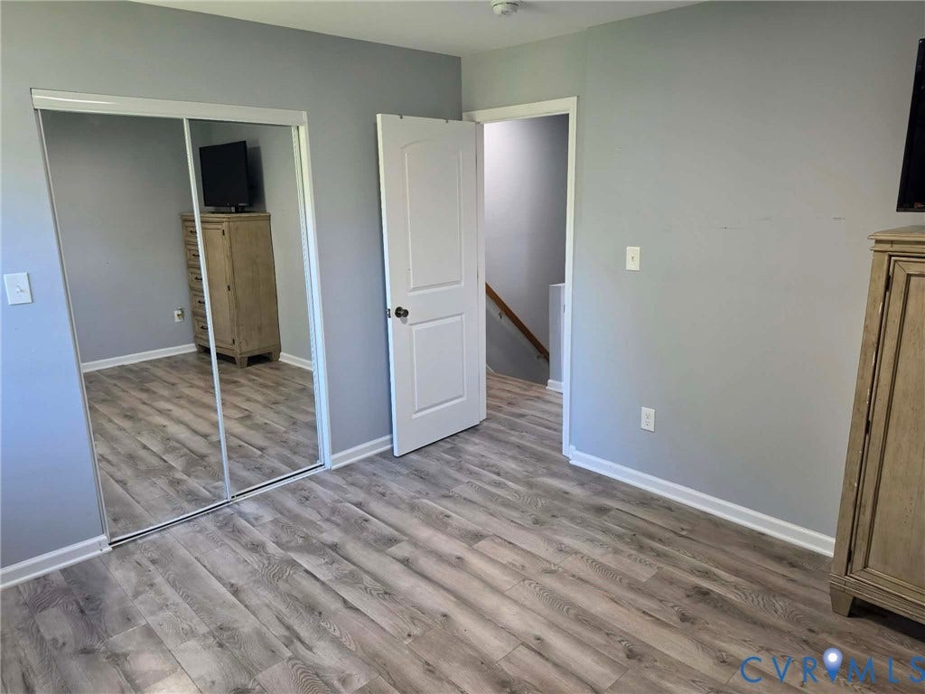 1351 Minefee Street, Bellemeade, Richmond, VA 23224 Bedroom #1 featuring LVP and a spacious closet.