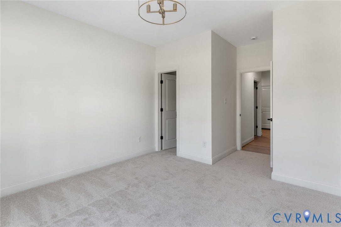 2831 Old Pump Road, The Preserve At John Rolfe, Henrico, VA 23233 Recessed lighting, light-toned carpet, and a modern chandelier