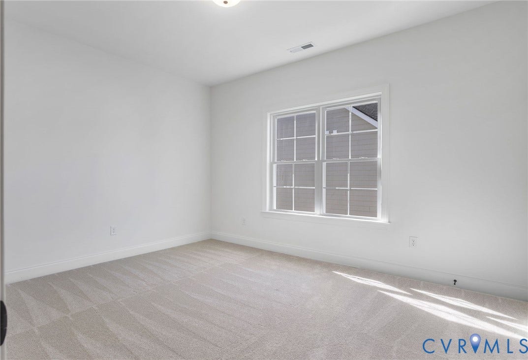 2831 Old Pump Road, The Preserve At John Rolfe, Henrico, VA 23233 Light-colored wall-to-wall carpeting, white painted walls, and a multi-pane window with white trim
