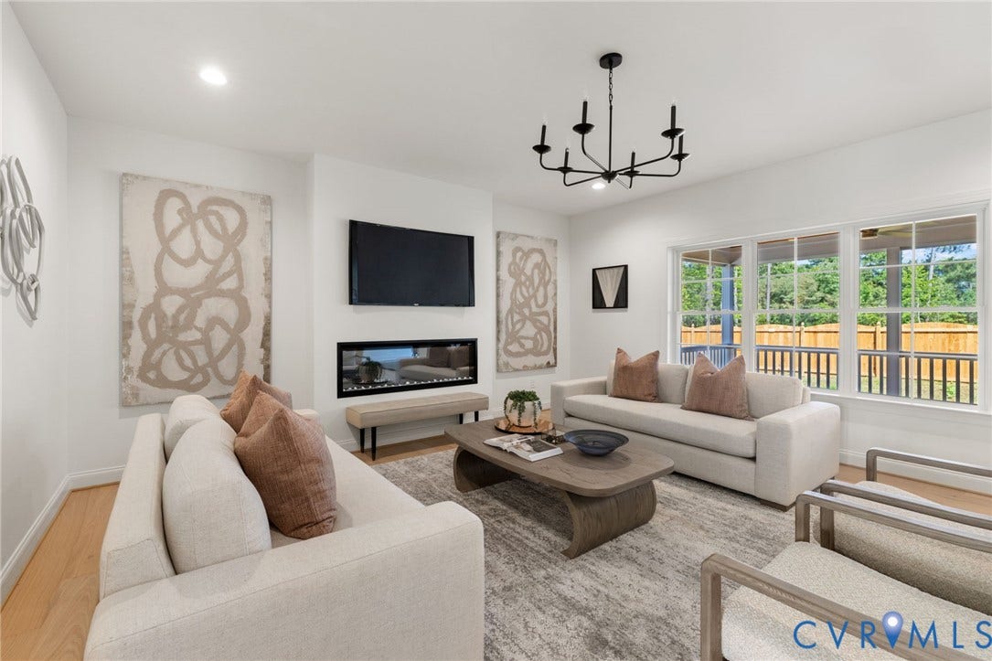 2831 Old Pump Road, The Preserve At John Rolfe, Henrico, VA 23233 Recessed lighting, wood-finish flooring, a linear fireplace, large windows, and a multi-arm chandelier