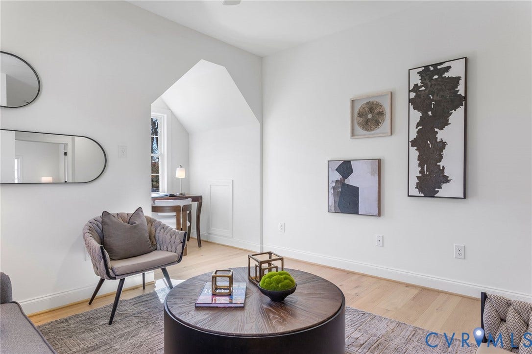 2831 Old Pump Road, The Preserve At John Rolfe, Henrico, VA 23233 Light wood-finish flooring with white baseboards, a distinctive arched doorway, and built-in window framing
