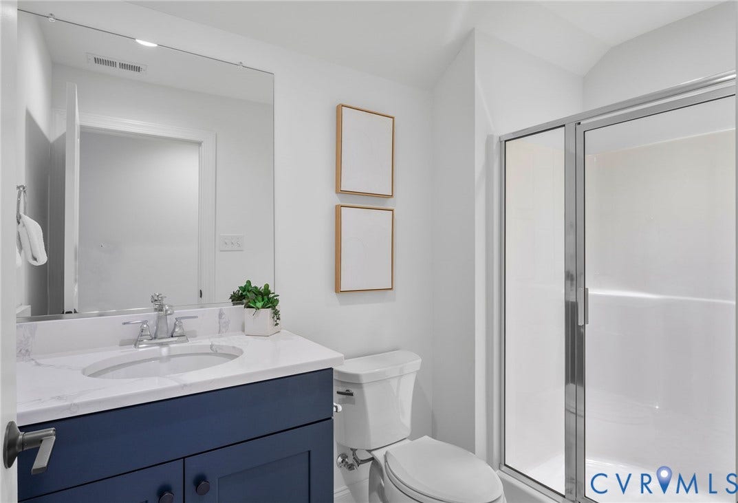 2831 Old Pump Road, The Preserve At John Rolfe, Henrico, VA 23233 Vanity with a stone-finish countertop, single basin sink, and chrome faucet