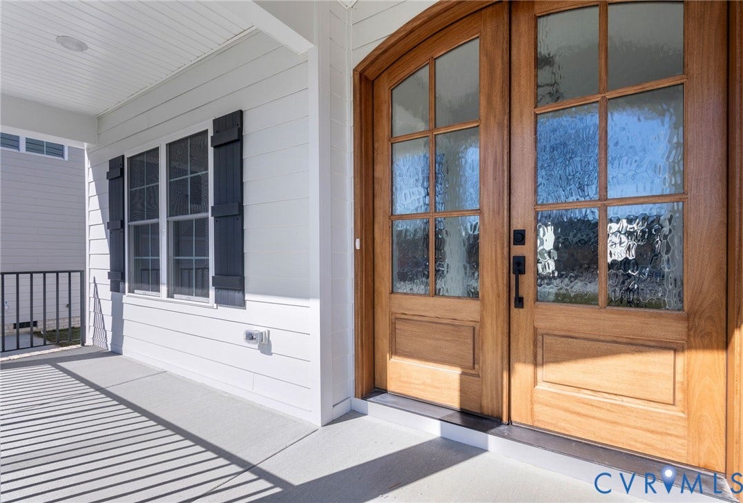 2831 Old Pump Road, The Preserve At John Rolfe, Henrico, VA 23233 Double wood-panel entry doors with textured glass, black hardware, and arched transom