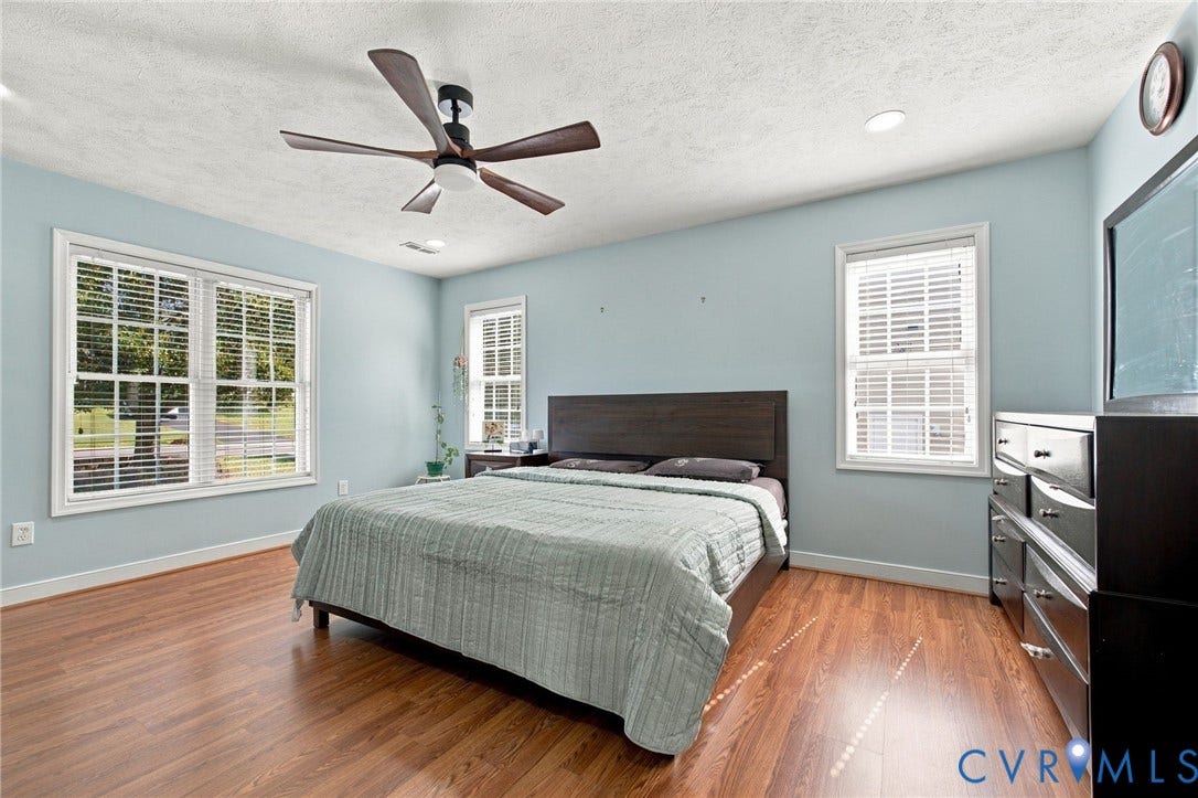 8119 Castle Grove Drive, Mechanicsville, VA 23111 Primary bedroom featuring wood-finish flooring, recessed lighting, a five-blade ceiling fan, and multi-pane windows with horizontal blinds