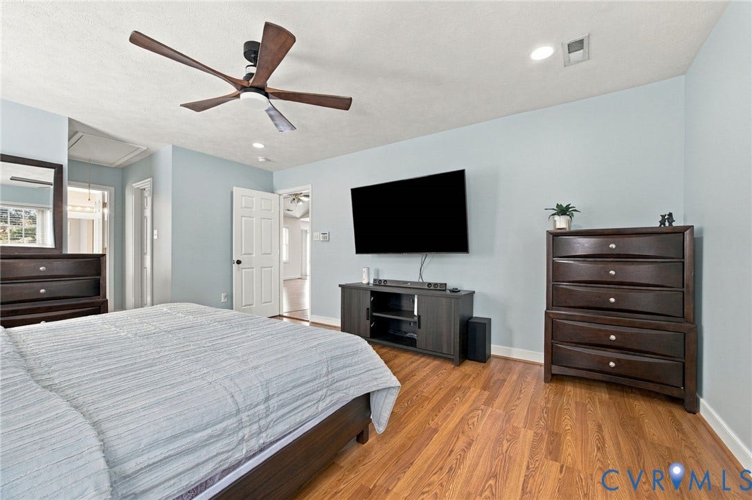 8119 Castle Grove Drive, Mechanicsville, VA 23111 Primary bedroom featuring wood-finish flooring, recessed lighting, and a multi-blade ceiling fan