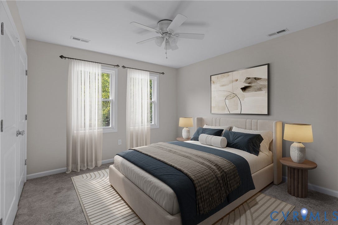 12089 Monterey Road, Ruther Glen, VA 22546 Neutral-toned interior featuring plush carpeting, dual-pane windows, and a ceiling fan with integrated lighting