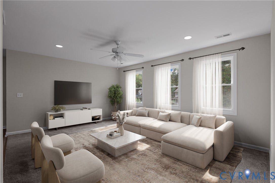 12089 Monterey Road, Ruther Glen, VA 22546 Living area featuring recessed lighting, three windows with drapery hardware, and a ceiling fan with integrated lighting