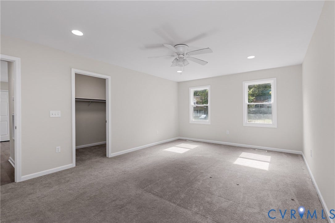 12089 Monterey Road, Ruther Glen, VA 22546 Neutral-toned room featuring plush wall-to-wall carpeting, recessed lighting, a white ceiling fan with integrated light fixture, and two windows